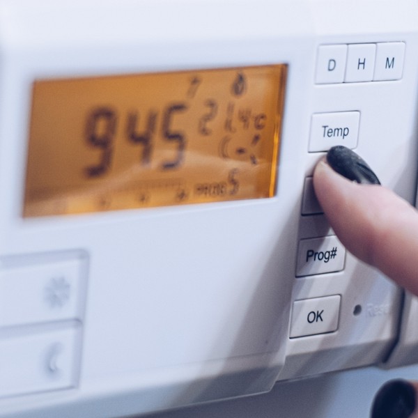 Thermostat controlling heating and hot water from gas central heating system