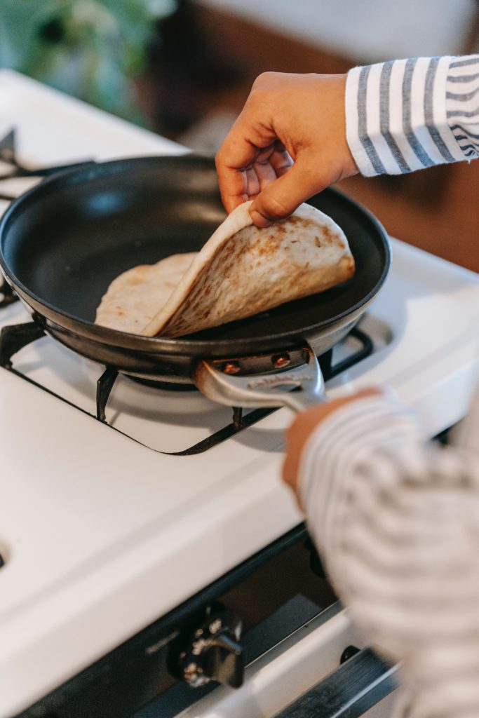 Use of a frying pan on a commercial kitchen gas hob